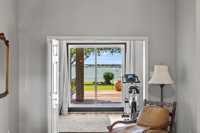 5556 Canada Ct, Rockwall, TX 75032 - doorway to outside featuring a water view and wood finished floors