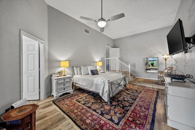 5556 Canada Ct, Rockwall, TX 75032 - bedroom featuring vaulted ceiling, light wood finished floors, baseboards, and ceiling fan