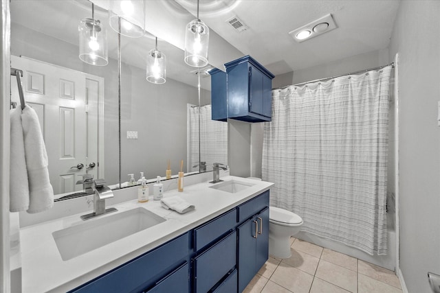5556 Canada Ct, Rockwall, TX 75032 - bathroom with toilet, double vanity, tile patterned floors, and shower / bath combo