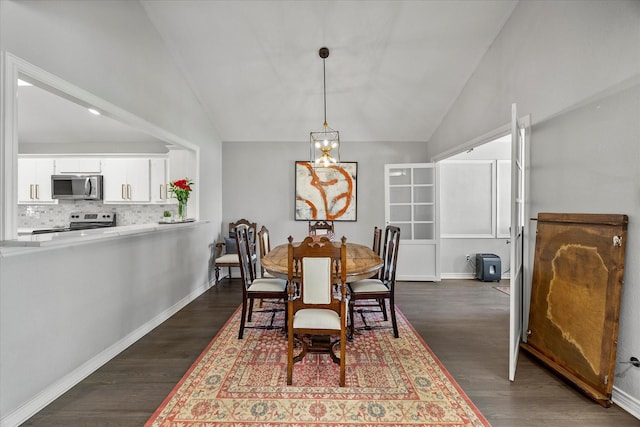 5556 Canada Ct, Rockwall, TX 75032 - dining space featuring dark wood finished floors, baseboards, and high vaulted ceiling