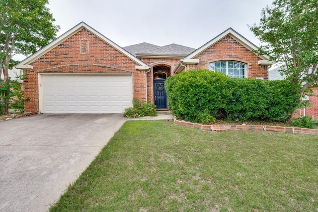 1004 Broken Spoke Dr, Little Elm, TX 75068 - view of front facade with brick siding, a garage, driveway, and a front yard