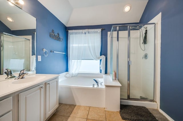 1004 Broken Spoke Dr, Little Elm, TX 75068 - full bathroom with lofted ceiling, vanity, a shower stall, a bath, and tile patterned floors