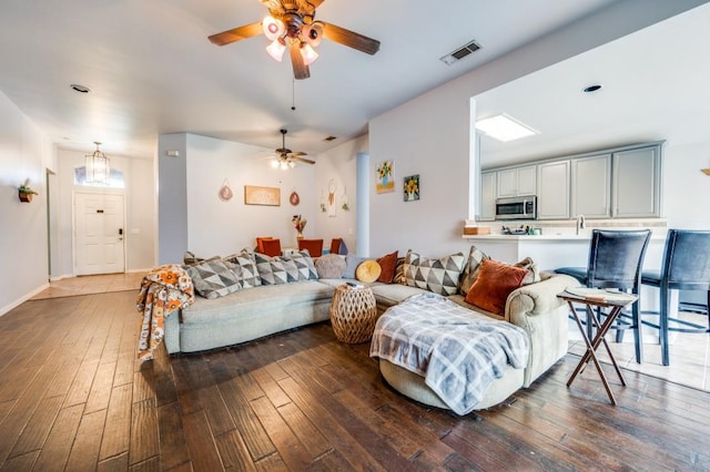 1004 Broken Spoke Dr, Little Elm, TX 75068 - living area featuring wood-type flooring and ceiling fan