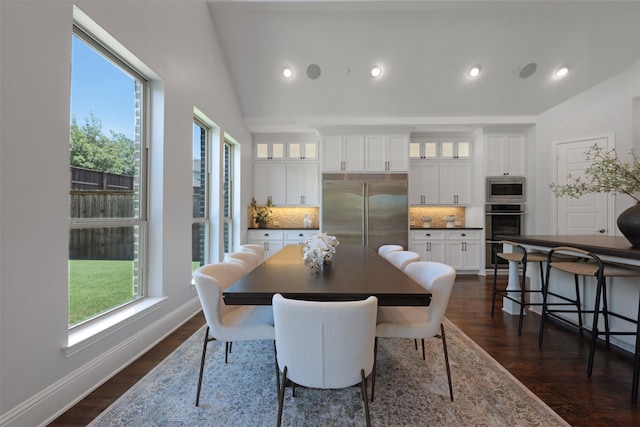 3690 Guinn Gate Dr, Frisco, TX 75034 - dining space with lofted ceiling, plenty of natural light, dark wood-style flooring, recessed lighting, and baseboards