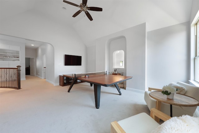 3690 Guinn Gate Dr, Frisco, TX 75034 - recreation room with light colored carpet, baseboards, a ceiling fan, high vaulted ceiling, and arched walkways