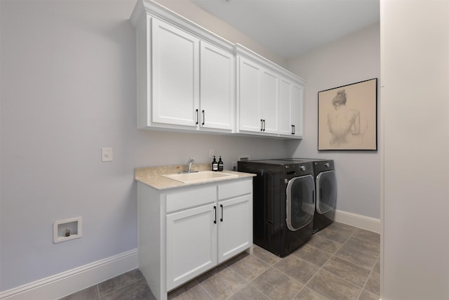 3690 Guinn Gate Dr, Frisco, TX 75034 - laundry area with cabinet space, baseboards, and separate washer and dryer