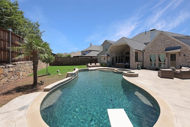 3690 Guinn Gate Dr, Frisco, TX 75034 - view of swimming pool with outdoor lounge area, a patio, a pool with connected hot tub, and a diving board