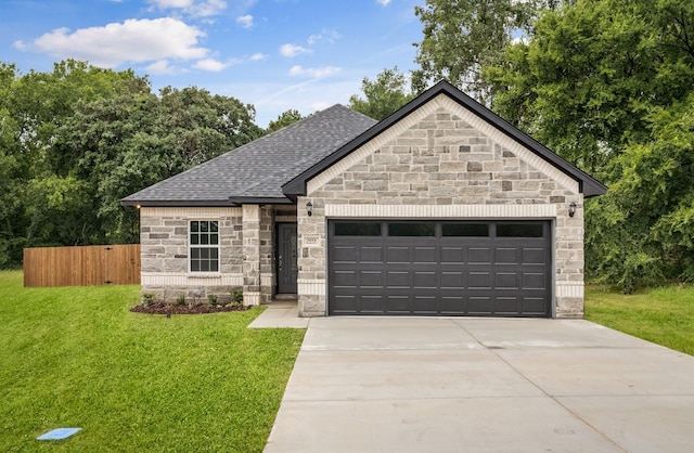 301 Kalura Way, Tool, TX 75143 - french country style house featuring stone siding, a garage, concrete driveway, and roof with shingles