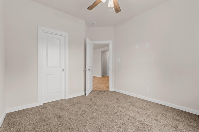 301 Kalura Way, Tool, TX 75143 - unfurnished bedroom with light colored carpet, baseboards, and ceiling fan