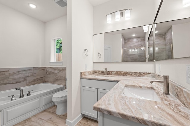 301 Kalura Way, Tool, TX 75143 - full bathroom with double vanity, a bath, a stall shower, toilet, and recessed lighting