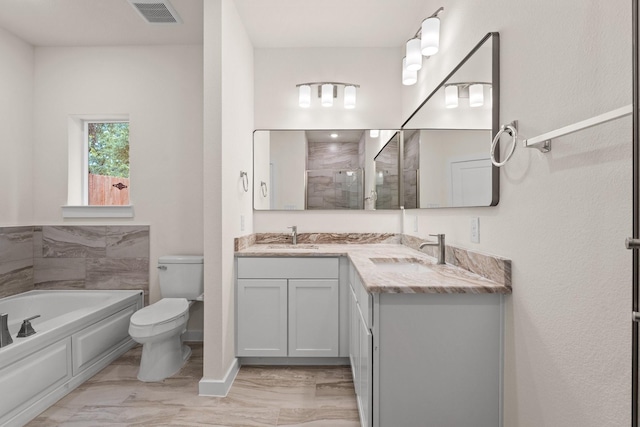 301 Kalura Way, Tool, TX 75143 - bathroom with a garden tub, toilet, double vanity, and a tile shower