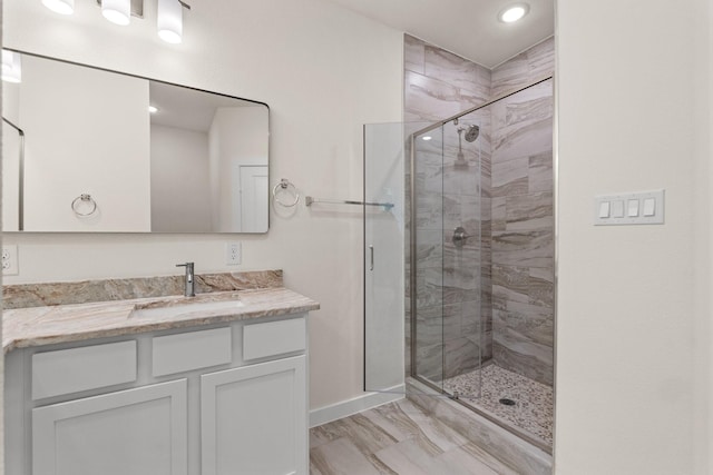 301 Kalura Way, Tool, TX 75143 - full bathroom featuring vanity, a shower stall, baseboards, recessed lighting, and marble finish flooring