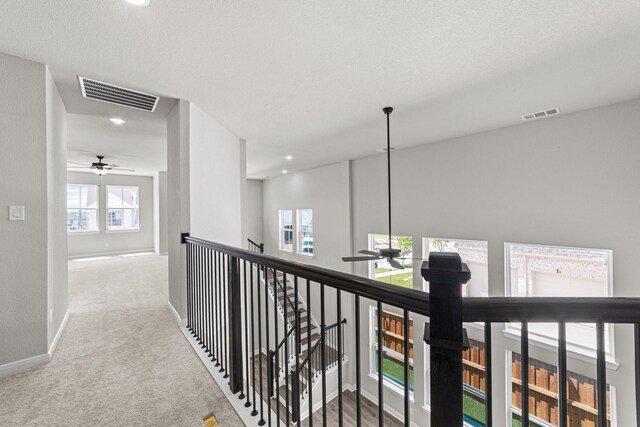 2013 Tolleson Dr, Fort Worth, TX 76008 - hall with an upstairs landing, carpet, baseboards, and recessed lighting