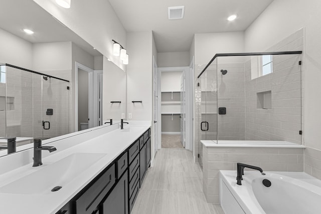 2013 Tolleson Dr, Fort Worth, TX 76008 - bathroom featuring a stall shower, a bath, double vanity, toilet, and recessed lighting
