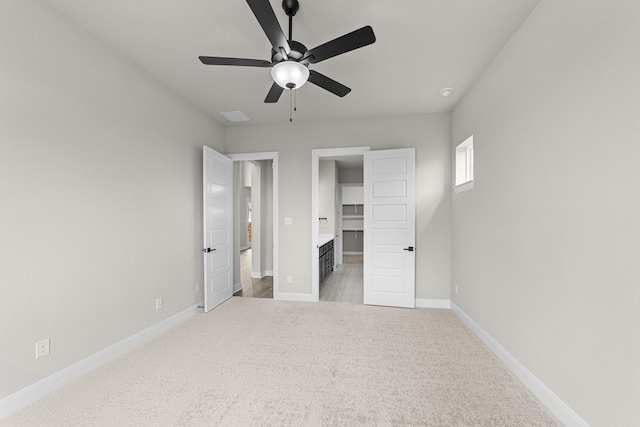 2013 Tolleson Dr, Fort Worth, TX 76008 - unfurnished bedroom with light carpet, baseboards, a spacious closet, and a ceiling fan