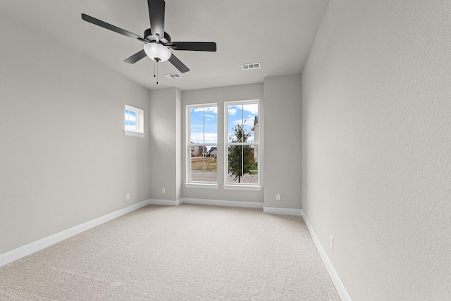 2013 Tolleson Dr, Fort Worth, TX 76008 - spare room with baseboards, light colored carpet, and ceiling fan