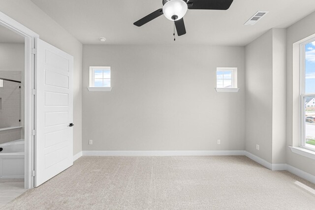 2013 Tolleson Dr, Fort Worth, TX 76008 - unfurnished bedroom with light carpet, baseboards, and a ceiling fan