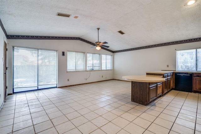 4012 Shackelford Dr, Mesquite, TX 75150 - kitchen with black dishwasher, lofted ceiling, ceiling fan, light tile patterned flooring, and light countertops