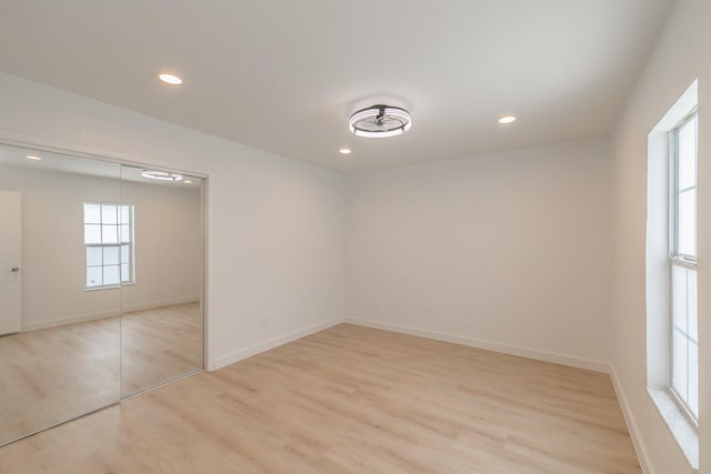 11417 Park Central Pl, Dallas, TX 75230 - spare room with light wood-style floors, recessed lighting, and baseboards