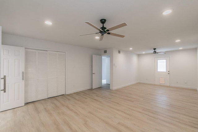 11417 Park Central Pl, Dallas, TX 75230 - unfurnished bedroom featuring light wood-style flooring, recessed lighting, baseboards, and a closet