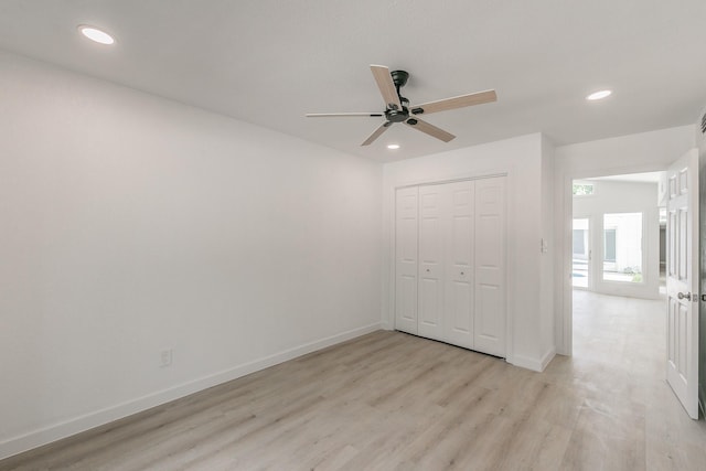11417 Park Central Pl, Dallas, TX 75230 - unfurnished bedroom with light wood-type flooring, recessed lighting, baseboards, a closet, and ceiling fan