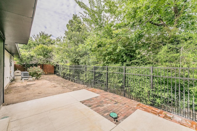 11417 Park Central Pl, Dallas, TX 75230 - fenced backyard featuring a patio area and central AC unit