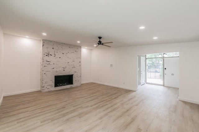 11417 Park Central Pl, Dallas, TX 75230 - unfurnished living room featuring recessed lighting, a tile fireplace, light wood-style flooring, ceiling fan, and baseboards