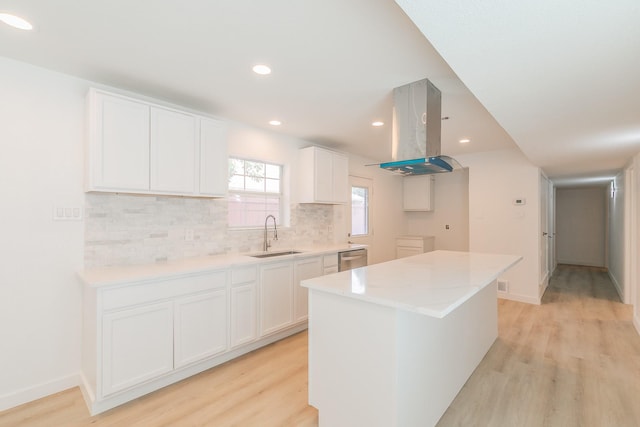 11417 Park Central Pl, Dallas, TX 75230 - kitchen featuring island exhaust hood, a sink, light wood-type flooring, white cabinetry, and recessed lighting