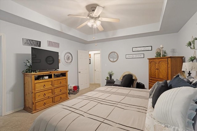 2215 Albert Broadfoot St, Bonham, TX 75418 - bedroom featuring light colored carpet, a raised ceiling, a ceiling fan, and baseboards