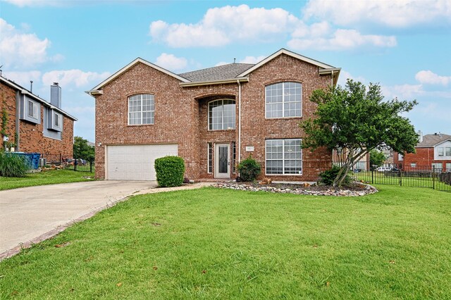 6018 San Marino Ct, Rowlett, TX 75089 - traditional-style house with a garage, driveway, and brick siding