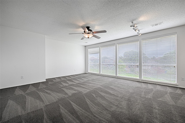 6018 San Marino Ct, Rowlett, TX 75089 - spare room with carpet flooring, ceiling fan, a textured ceiling, and baseboards