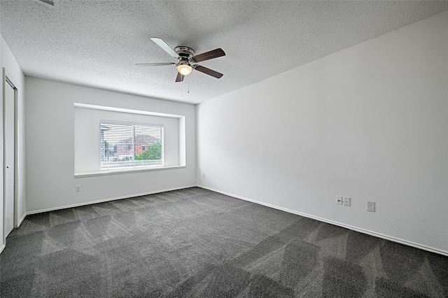 6018 San Marino Ct, Rowlett, TX 75089 - unfurnished bedroom with dark carpet, a textured ceiling, and a ceiling fan