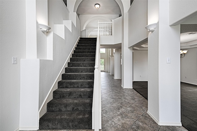 6018 San Marino Ct, Rowlett, TX 75089 - staircase with baseboards and a towering ceiling