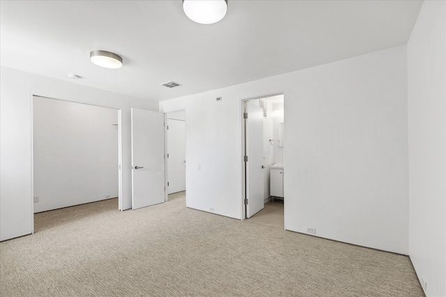 33 Vanguard Way, Dallas, TX 75243 - unfurnished bedroom with light carpet, a closet, and ensuite bath