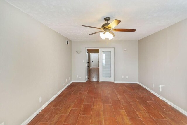 243 Barclay Ave, Coppell, TX 75019 - spare room with ceiling fan, baseboards, and wood finished floors