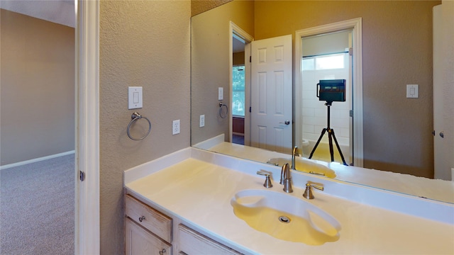 5205 Promise Land Dr, Frisco, TX 75035 - bathroom featuring vanity, a textured wall, and baseboards