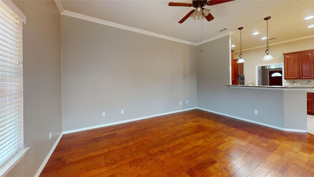 5205 Promise Land Dr, Frisco, TX 75035 - unfurnished living room with ceiling fan, wood finished floors, crown molding, baseboards, and recessed lighting