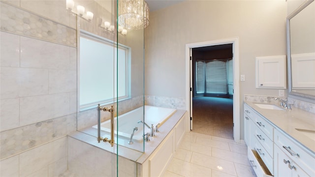 5205 Promise Land Dr, Frisco, TX 75035 - full bath featuring double vanity, tile patterned floors, a bath, and a chandelier
