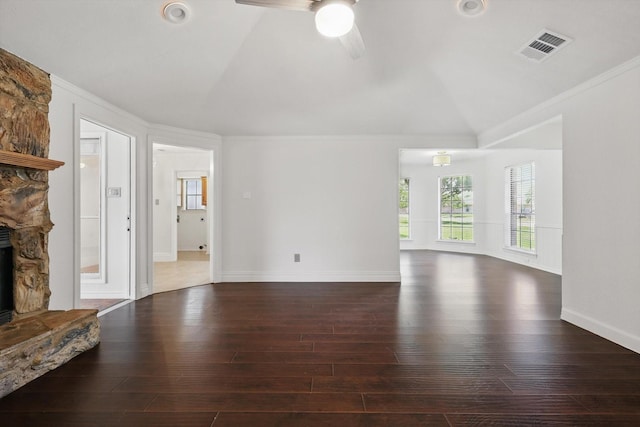 6509 Parkridge Dr, Sachse, TX 75048 - unfurnished living room with lofted ceiling, hardwood / wood-style flooring, crown molding, ceiling fan, and a stone fireplace