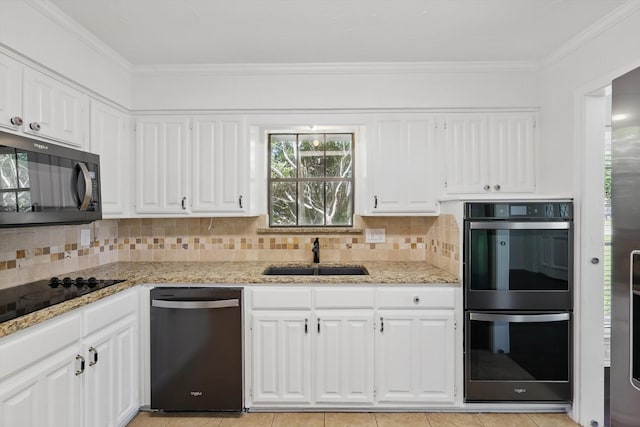 6509 Parkridge Dr, Sachse, TX 75048 - kitchen with a sink, dishwashing machine, double oven, black electric cooktop, and tasteful backsplash