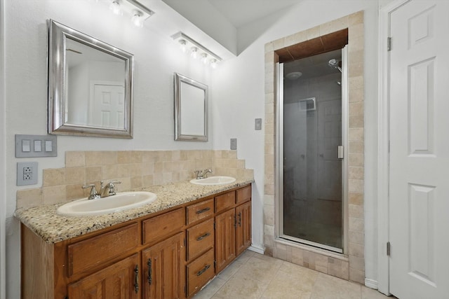 6509 Parkridge Dr, Sachse, TX 75048 - full bath featuring double vanity, a shower stall, tile patterned flooring, and tasteful backsplash