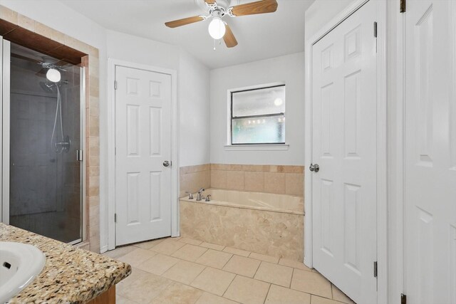 6509 Parkridge Dr, Sachse, TX 75048 - full bath with a closet, a bath, a stall shower, vanity, and tile patterned flooring