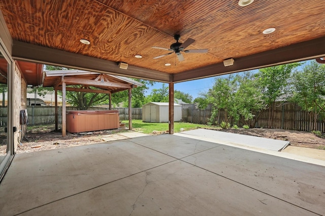6509 Parkridge Dr, Sachse, TX 75048 - fenced backyard featuring a hot tub, a patio, ceiling fan, and a gazebo
