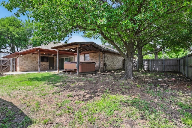 6509 Parkridge Dr, Sachse, TX 75048 - fenced backyard featuring a hot tub and a patio area