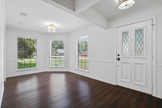 6509 Parkridge Dr, Sachse, TX 75048 - entrance foyer with dark wood finished floors, wainscoting, and crown molding
