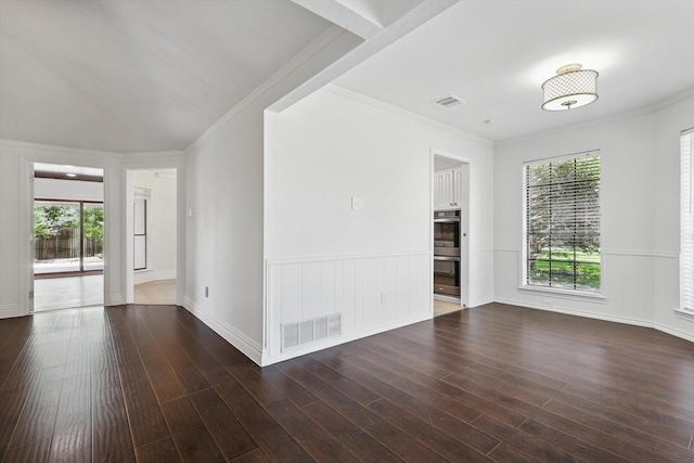 6509 Parkridge Dr, Sachse, TX 75048 - empty room with dark wood-style floors, crown molding, and baseboards