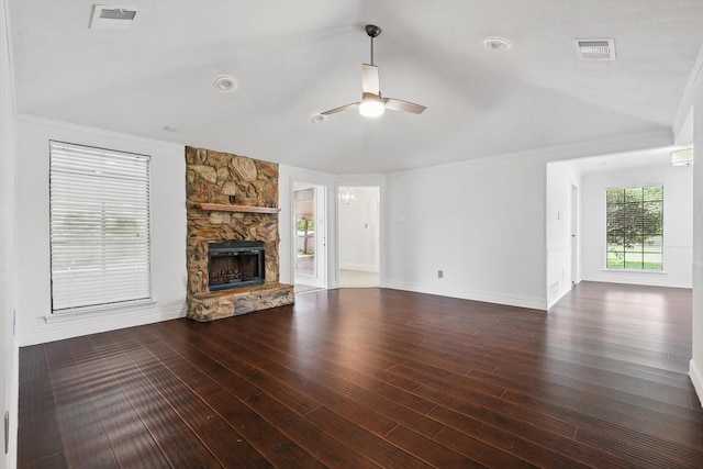 6509 Parkridge Dr, Sachse, TX 75048 - unfurnished living room featuring ceiling fan, wood finished floors, a stone fireplace, ornamental molding, and baseboards