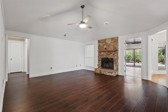 6509 Parkridge Dr, Sachse, TX 75048 - unfurnished living room with a ceiling fan, a stone fireplace, wood finished floors, crown molding, and lofted ceiling
