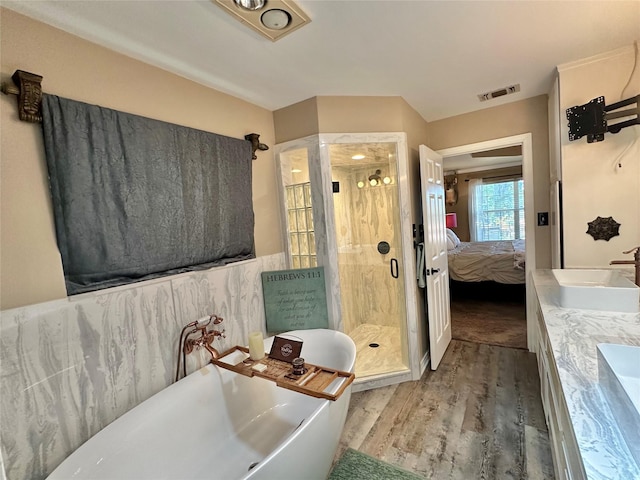 13449 S Hillcreek Rd, Whitehouse, TX 75791 - ensuite bathroom featuring a shower stall, wood finished floors, a soaking tub, and double vanity
