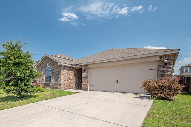 1206 Lombardy Dr, Princeton, TX 75407 - ranch-style house featuring brick siding, an attached garage, and concrete driveway
